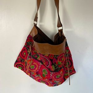 Large Wabag floral embroidered tote bag with leather shoulder strap with zipper.